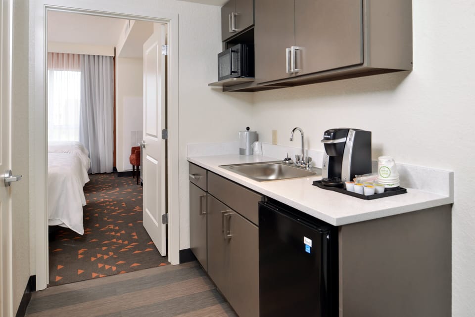 Hypo-allergenic bedding, desk, blackout drapes, soundproofing
