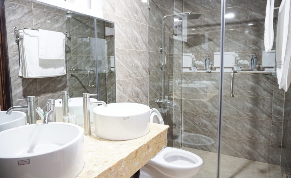 Shower, free toiletries, hair dryer, slippers
