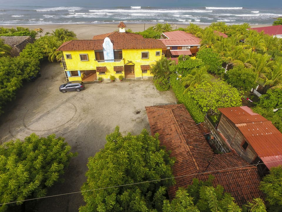 Back of the home parking, apartment and main house