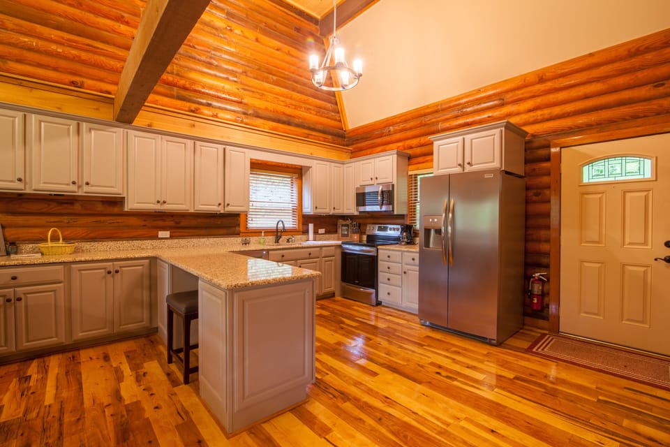 Open Kitchen on Main Level with Granite Counters and Custom Cabinetry