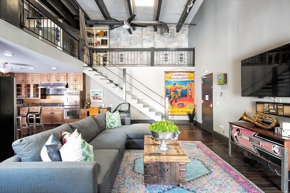 Open Living Space Overlooking Kitchen & Stairway to Primary Suite