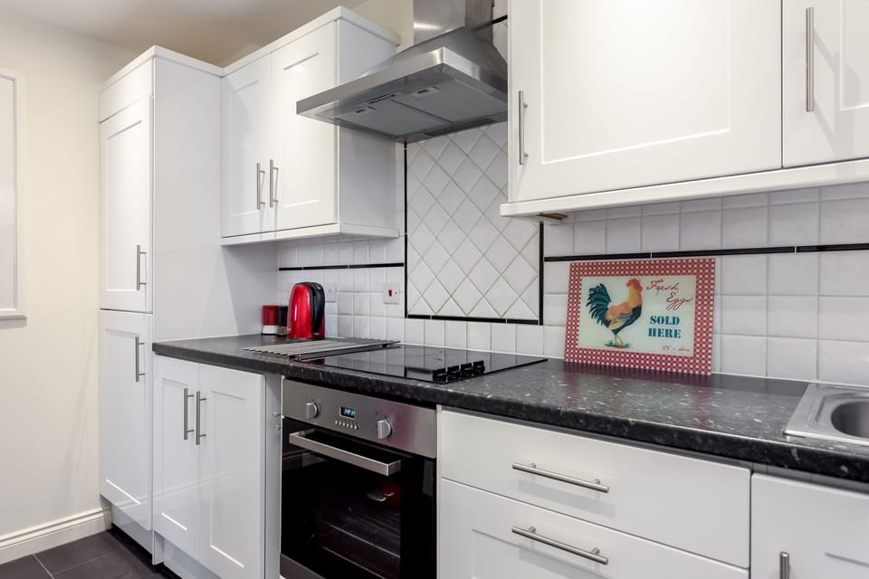 Kitchen with built in fridge freezer, dishwasher, washing machine and microwave