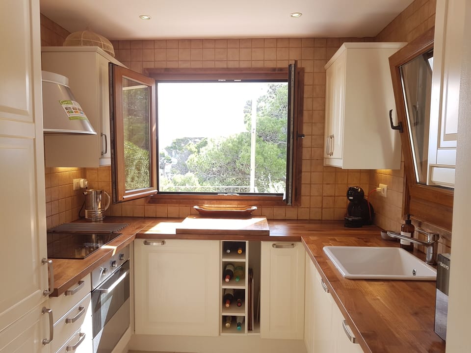 View of mountains and sea through the kitchen window
