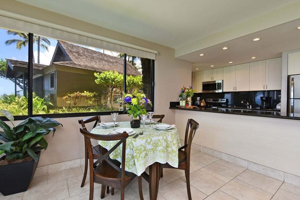 Charming indoor dining nook with a garden view, perfect for a cozy breakfast or family meal.