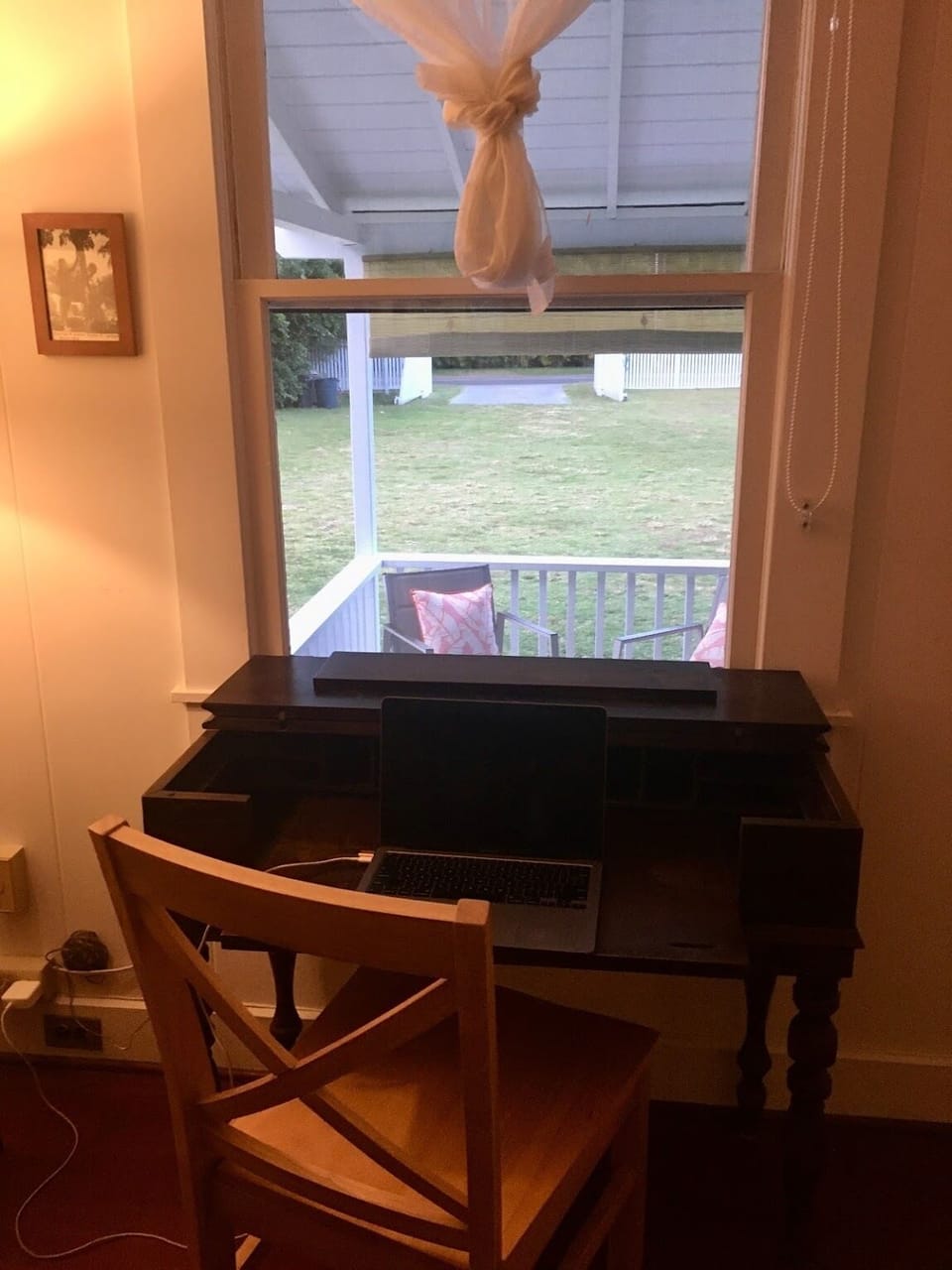 View out to garden from antique desk in living room