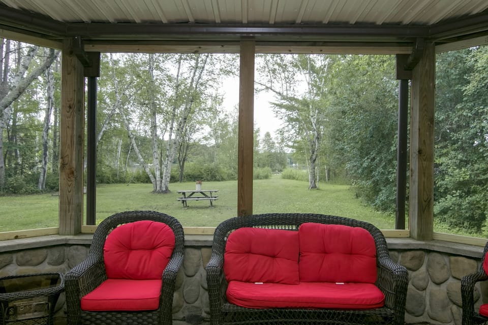 View from screened porch to lake. 