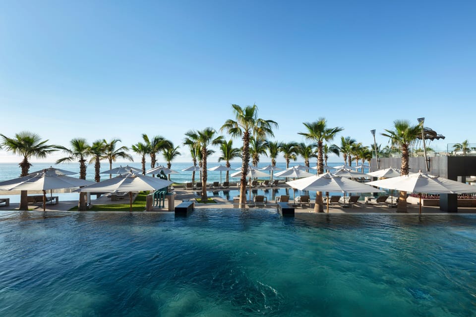 8 outdoor pools, pool umbrellas, sun loungers