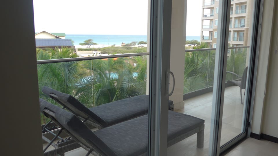 Balcony off master bdrm with a glorious view of the pool and ocean