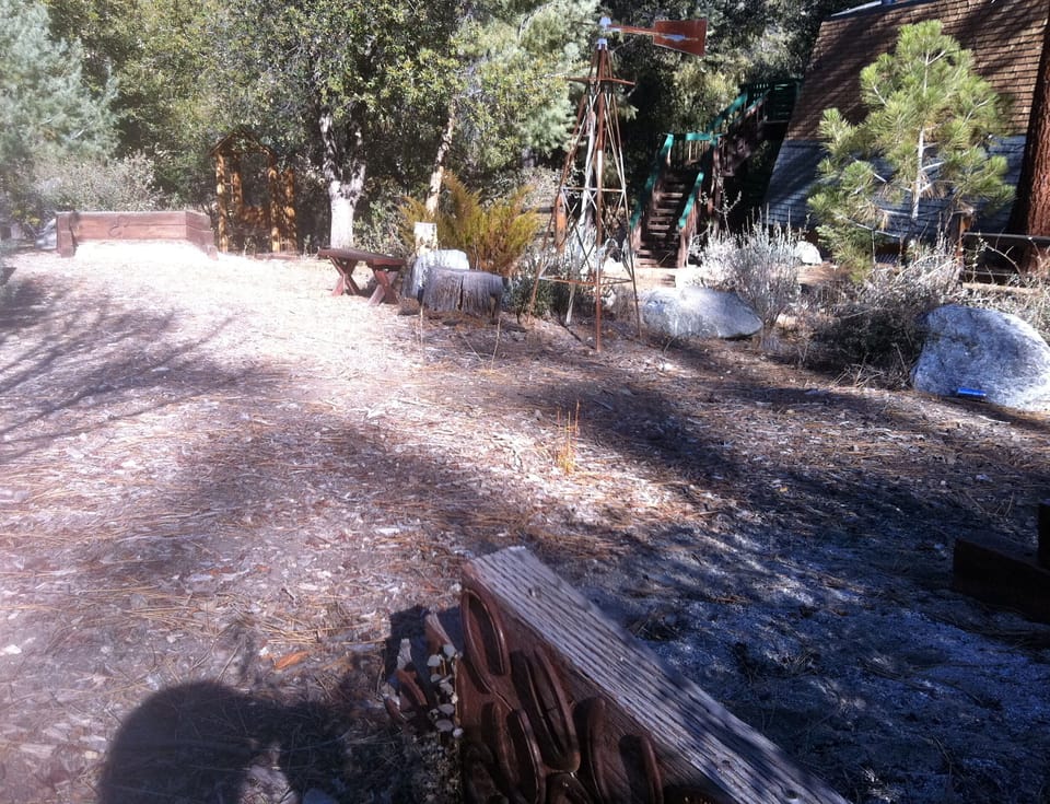 Horseshoe pit! And, windmill. You can see the steps of the cabin in background~~