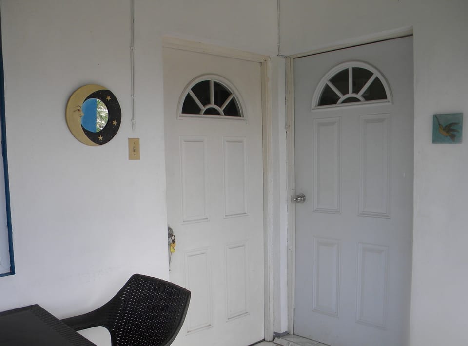 Upper level. Side by side doors. Adjoining suite on the right, Kitchen apt left