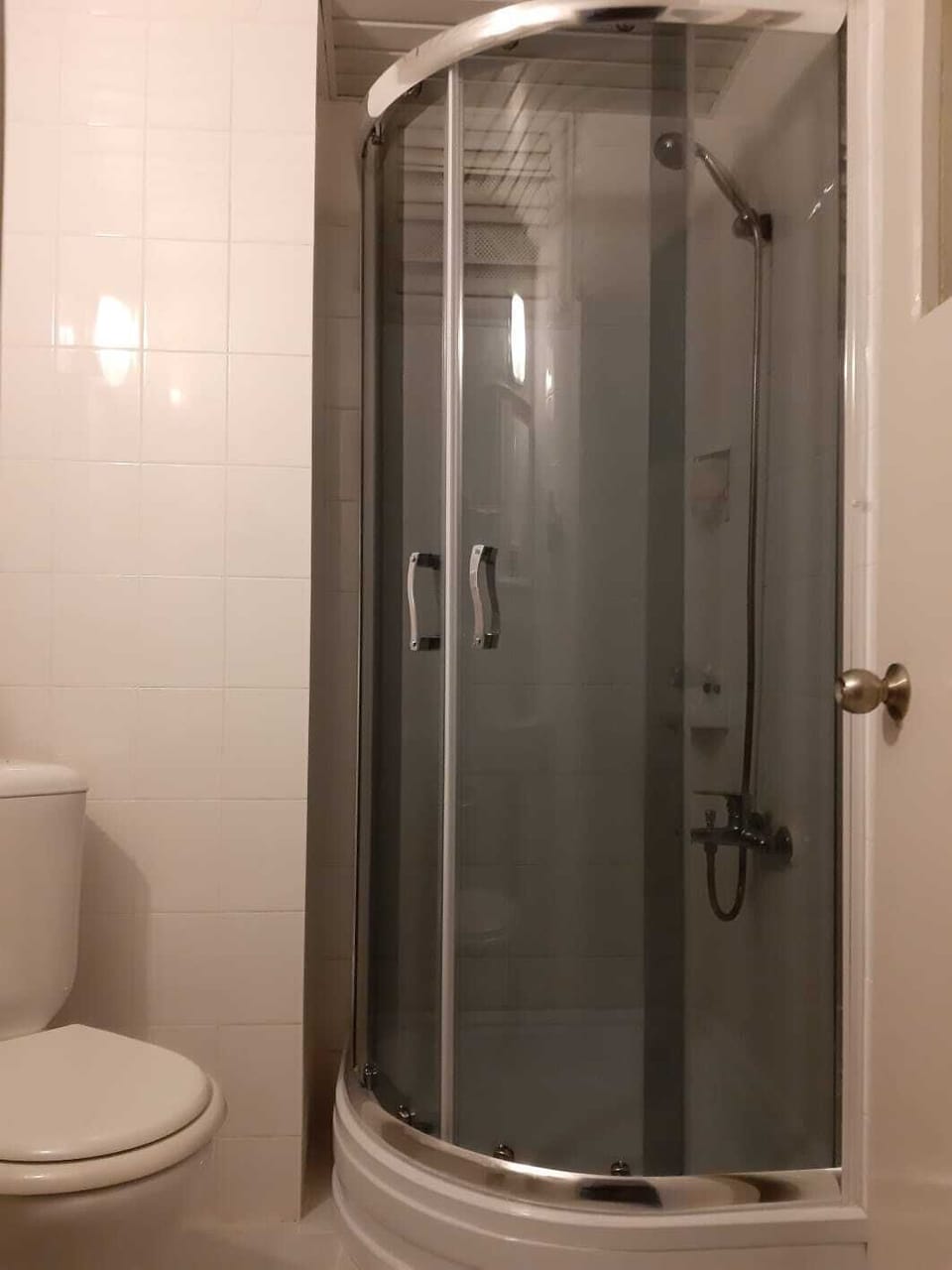 Shower, free toiletries, slippers, towels