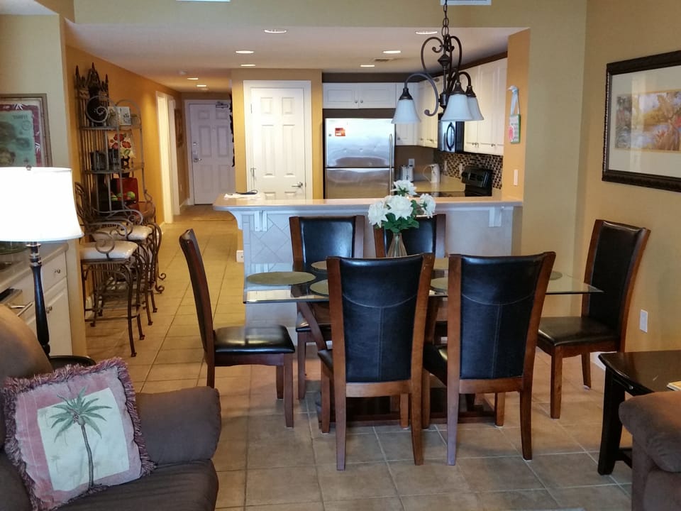 View of the dining room table and kitchen