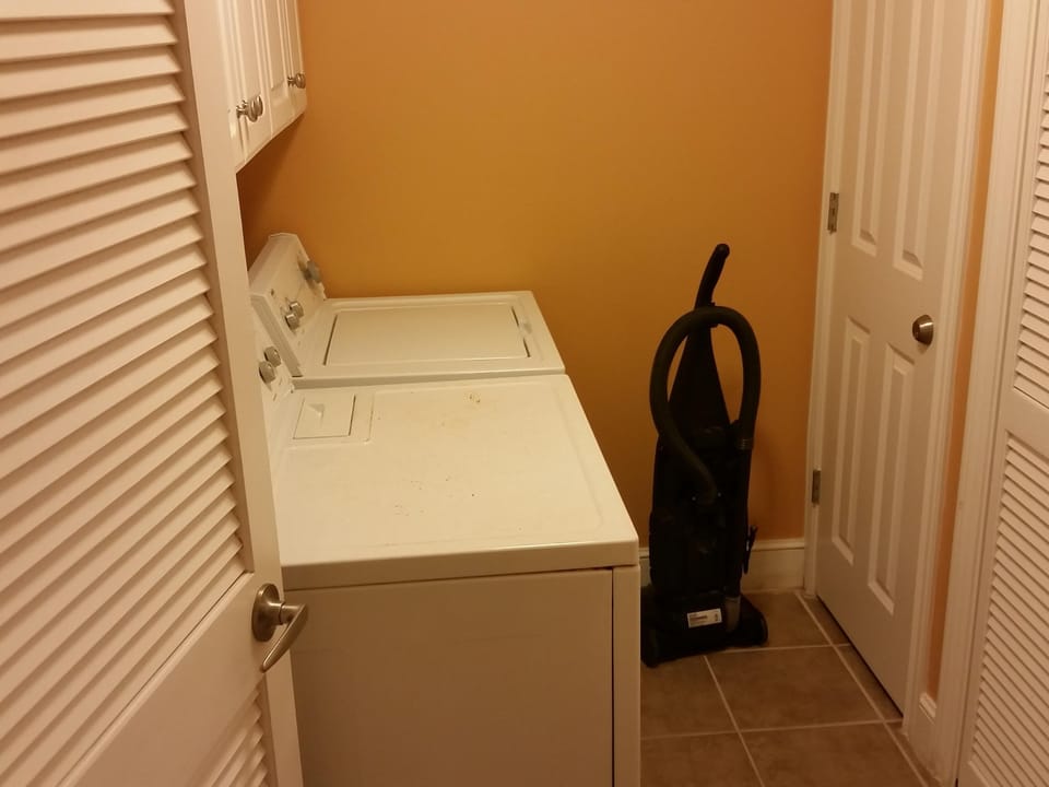 Enclosed laundry room with washer and dryer 