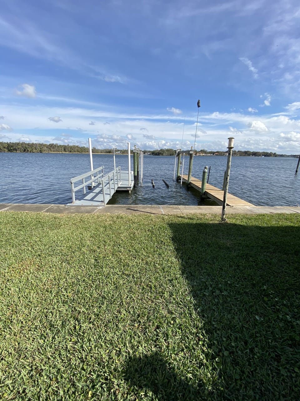 Two docks with view down the river toward three sisters springs.