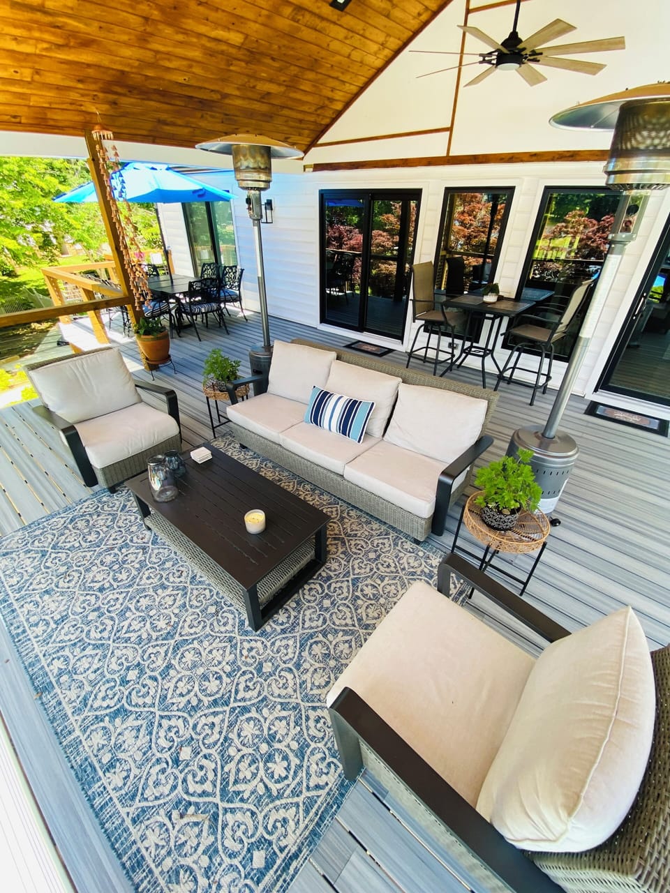 The large covered deck is the perfect spot to unwind while enjoying lake views.
