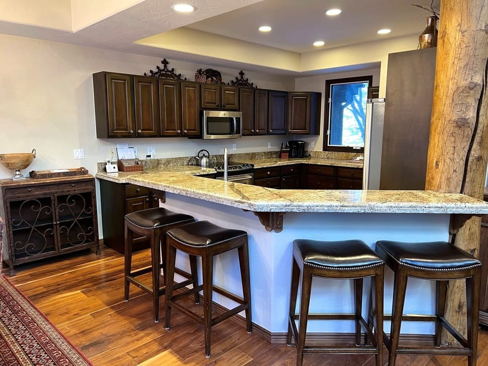 Bar/kitchen adjacent to the dining room for overspill dining area seating.