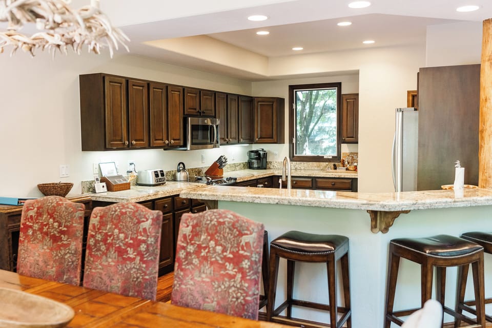 Enjoy meals with spacious seating for 8 Highchair is available upon request.