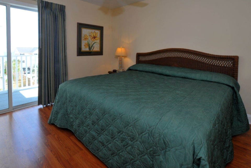 King size bedroom facing ocean upstairs with in suite bathroom.