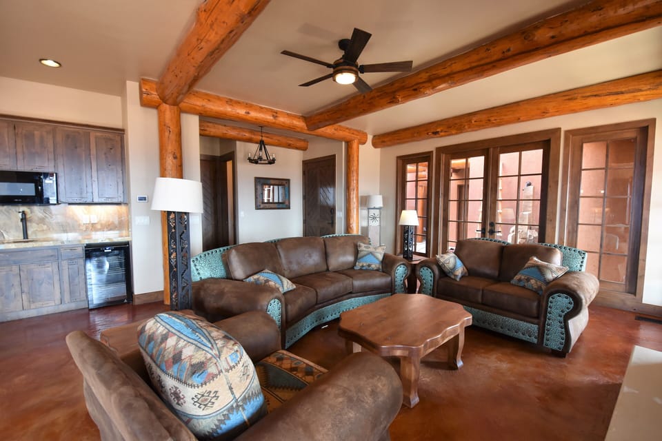 Living room with custom designed oversized couch, love seat and comfy chair.