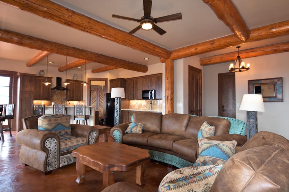 Upscale Living room and kitchen with custom furniture and high end finishes.