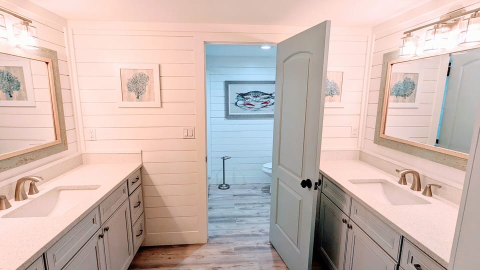 Bathroom 1: Double quartz vanities.