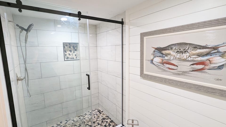 Bathroom 1: Stand-up/tiled shower.