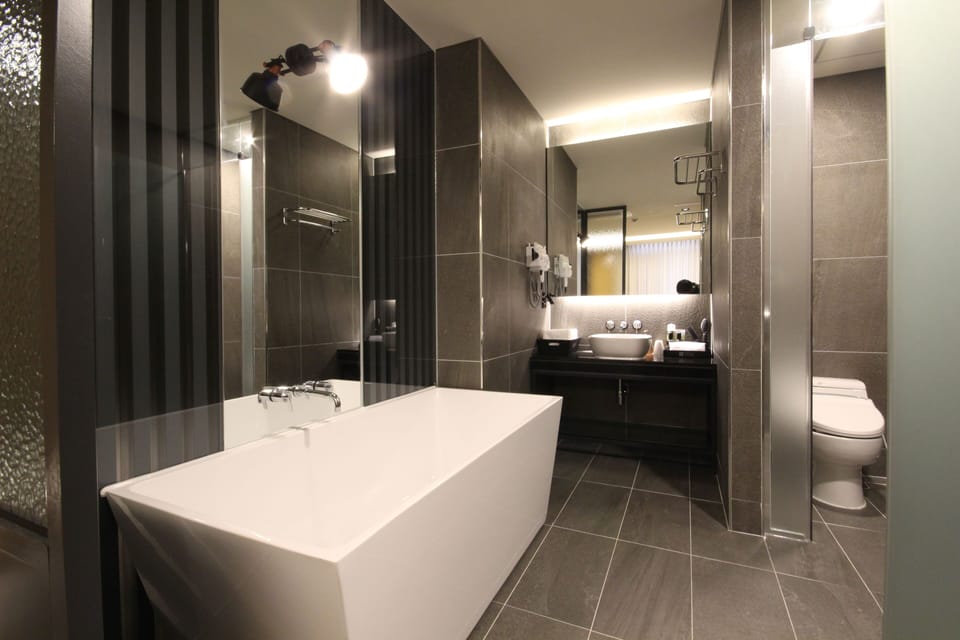 Standard Double Room | Bathroom | Separate tub and shower, deep soaking tub, free toiletries, hair dryer