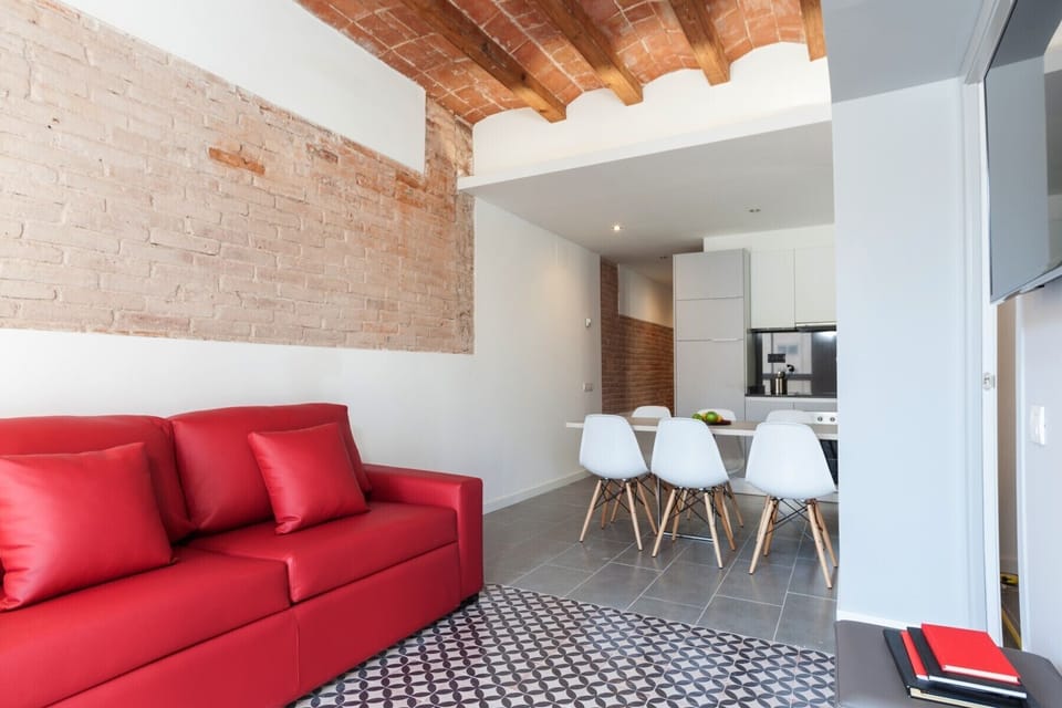 Comfortable living room with TV and dining area.