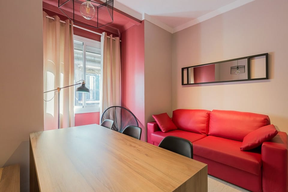 Living room with large, comfortable and modern sofa in Plaza España Barcelona center