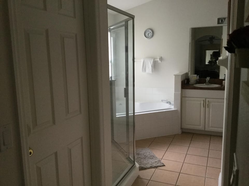 Master bath with shower stall and sunken bath tub