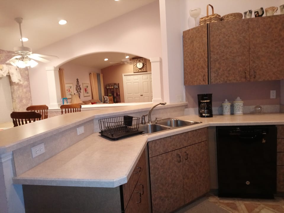 Kitchen with open view of dining room and living room