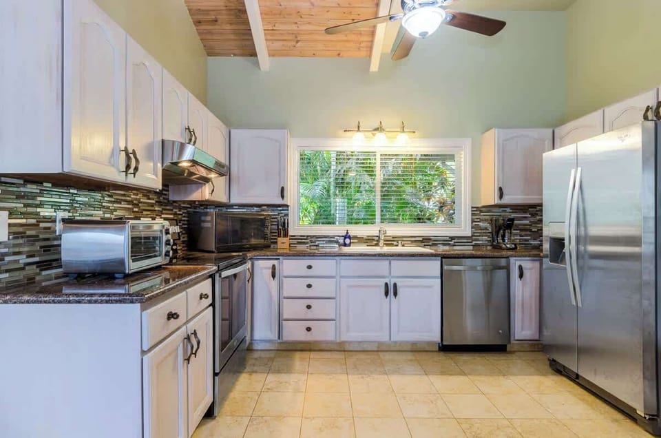 Newly renovated kitchen with appliances.