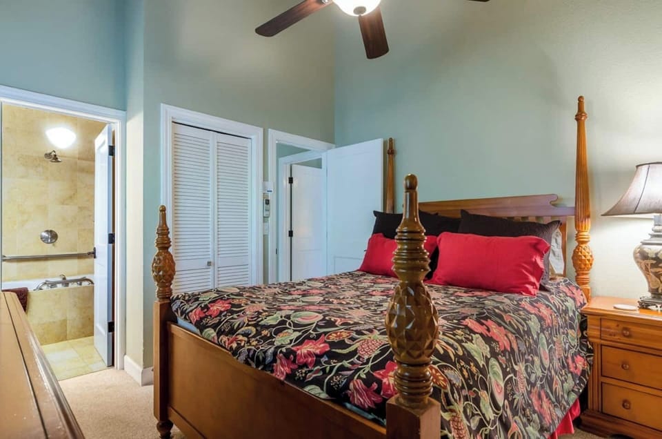 Bedroom 1: Master suite featuring a queen bed, AC and luxury bath.