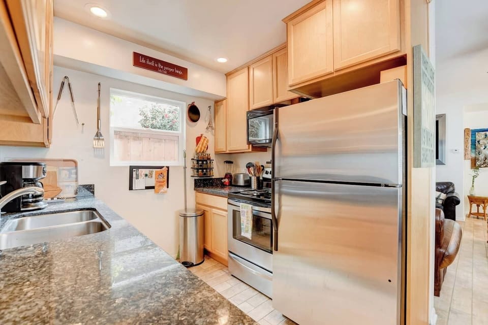 Granite, stainless steel and wood cabinets moderize this very functional kitchen