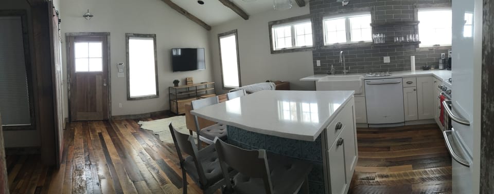 panorama view of kitchen/living & dining
