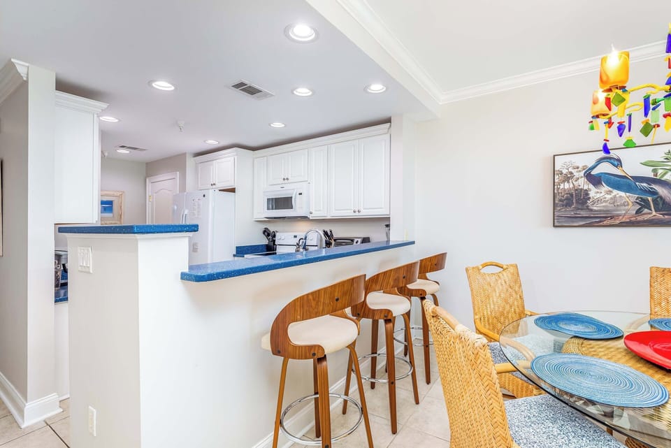 Dining table seats 5, breakfast bar seats 3