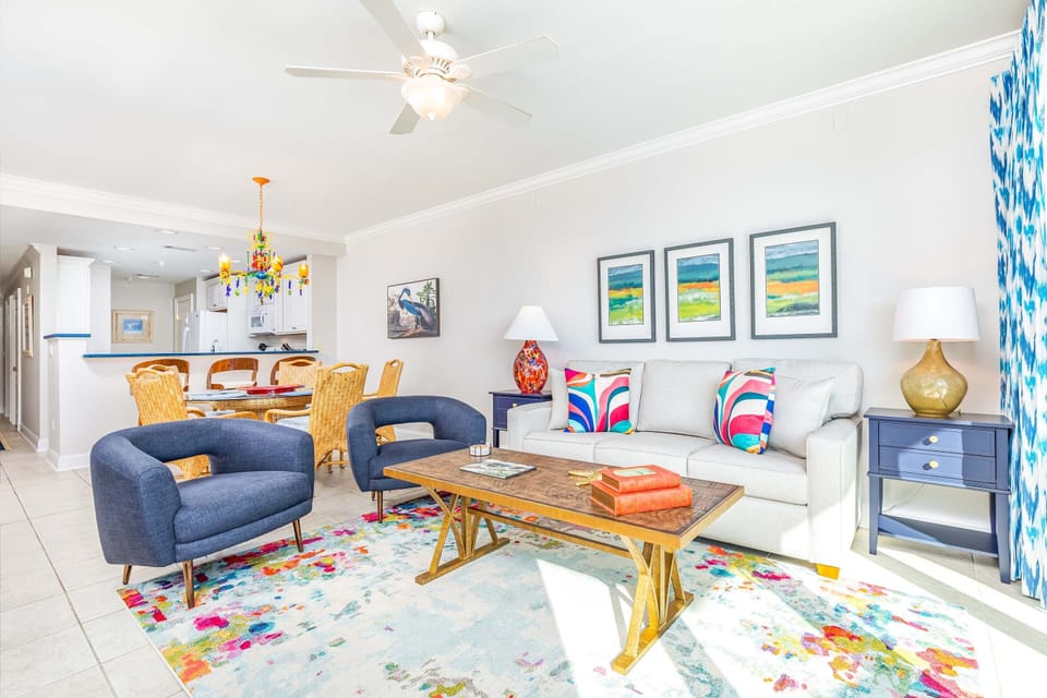 Living area with sleeper sofa, TV, and access to balcony