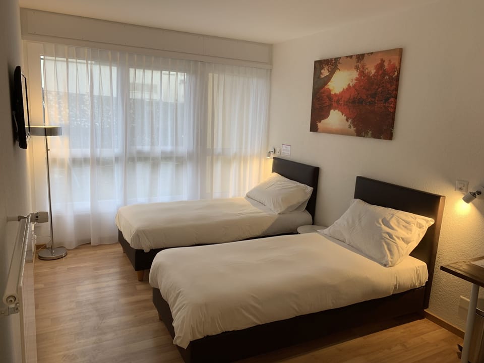Economy Room | Premium bedding, Select Comfort beds, free minibar, desk