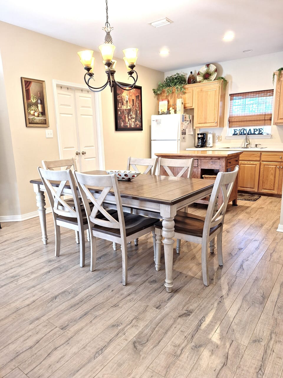 Dining area seats 6 to 8. Extra chairs are in the adjoining bedroom.