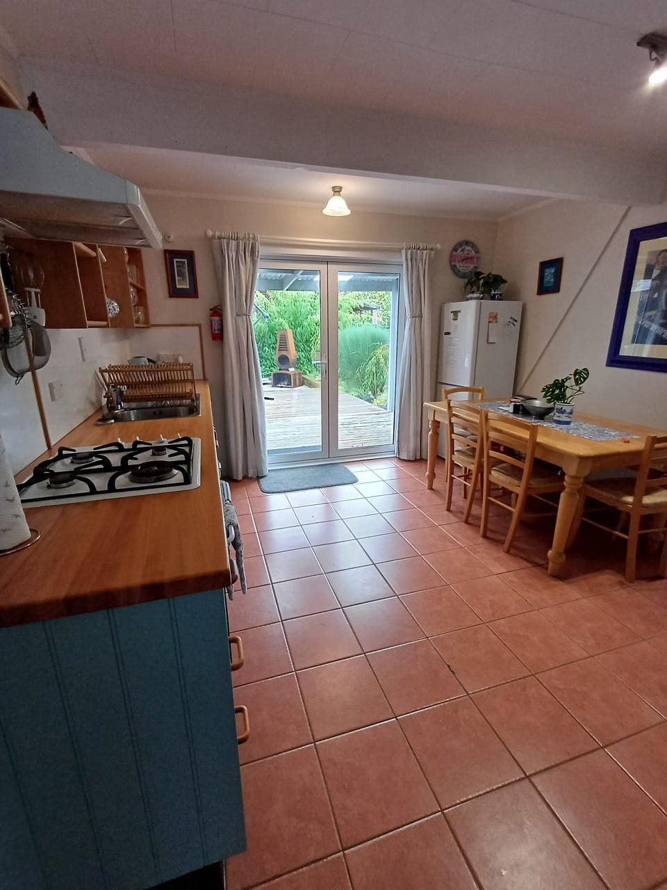  Fully equipped kitchen with seating for 6 leading to large outside patio.
