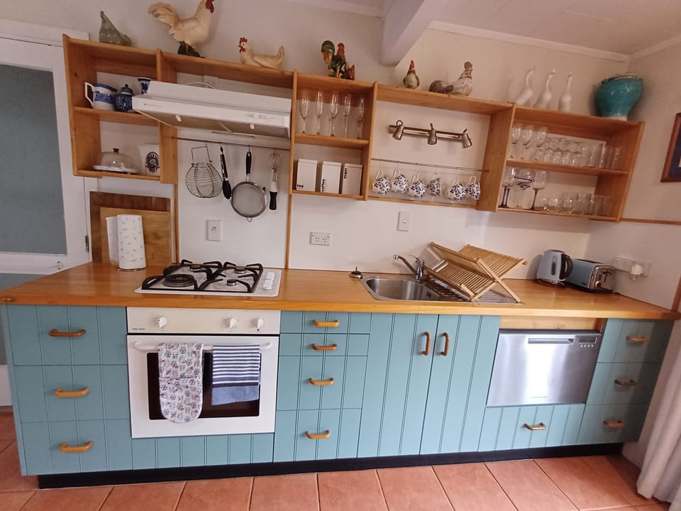  Fully equipped kitchen with seating for 6 leading to large outside patio.