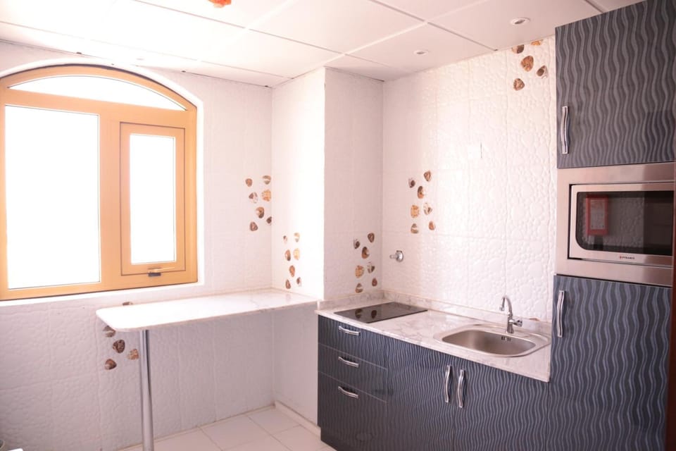 Fridge, microwave, electric kettle, cookware/dishes/utensils