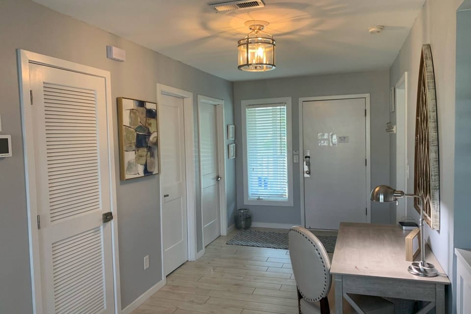 When you enter the front door, you will find this hallway that connects the kitchen, living room and the suites.