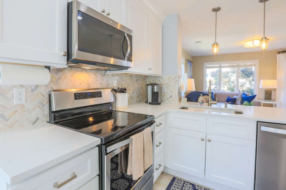 The beautiful kitchen is fully stocked for your stay.