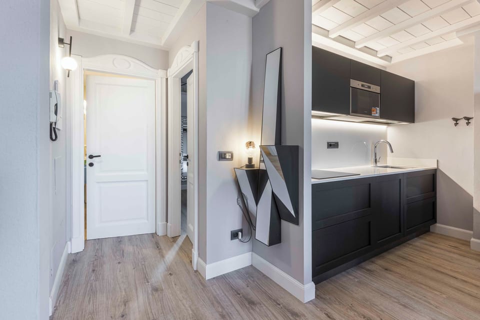 Apartment, 4 Bedrooms | Private kitchen | Full-size fridge, oven, stovetop, cookware/dishes/utensils