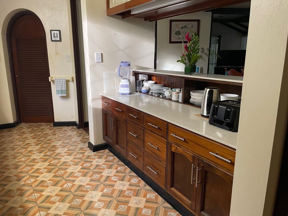 Fully stocked kitchen with kettle, toaster, blender & microwave. New tile floor.