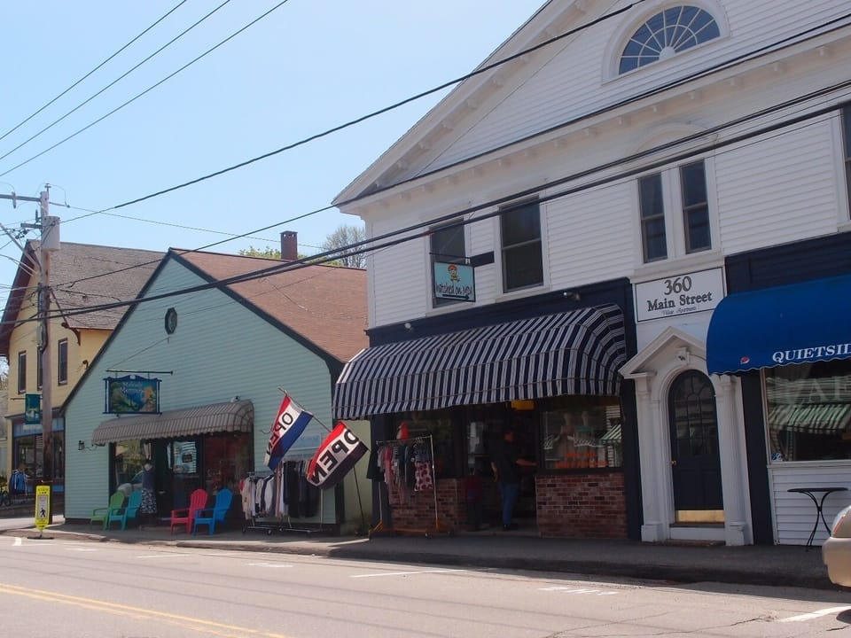 Studio is located in the rear of the green building on the left.  