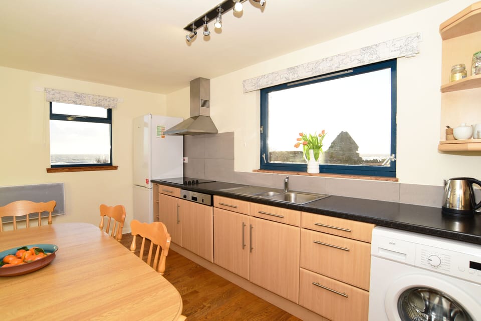 Large well equipped kitchen with seating for 6