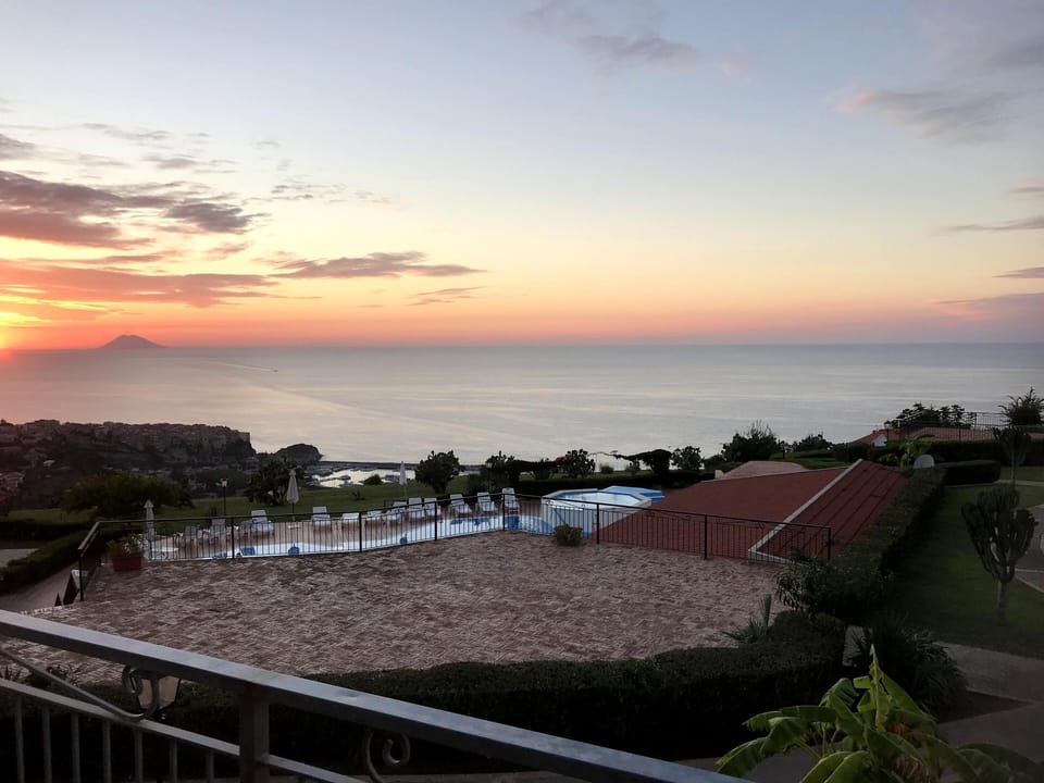 Watch the stunning sun set from the apartment balcony