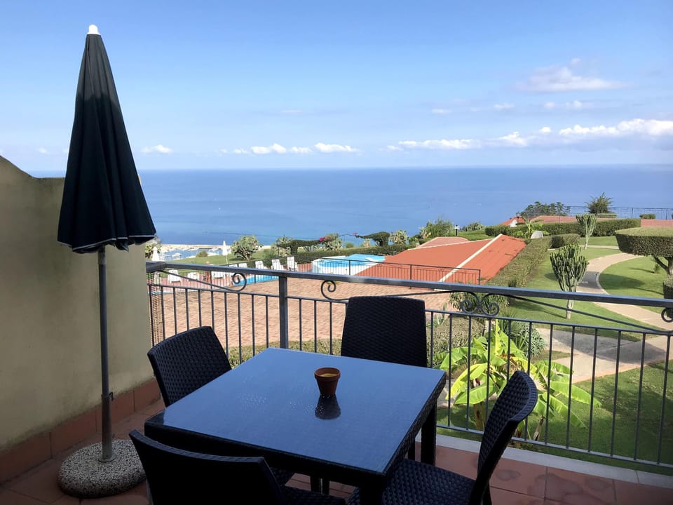 Balcony with outside table and chairs + a stunning view 